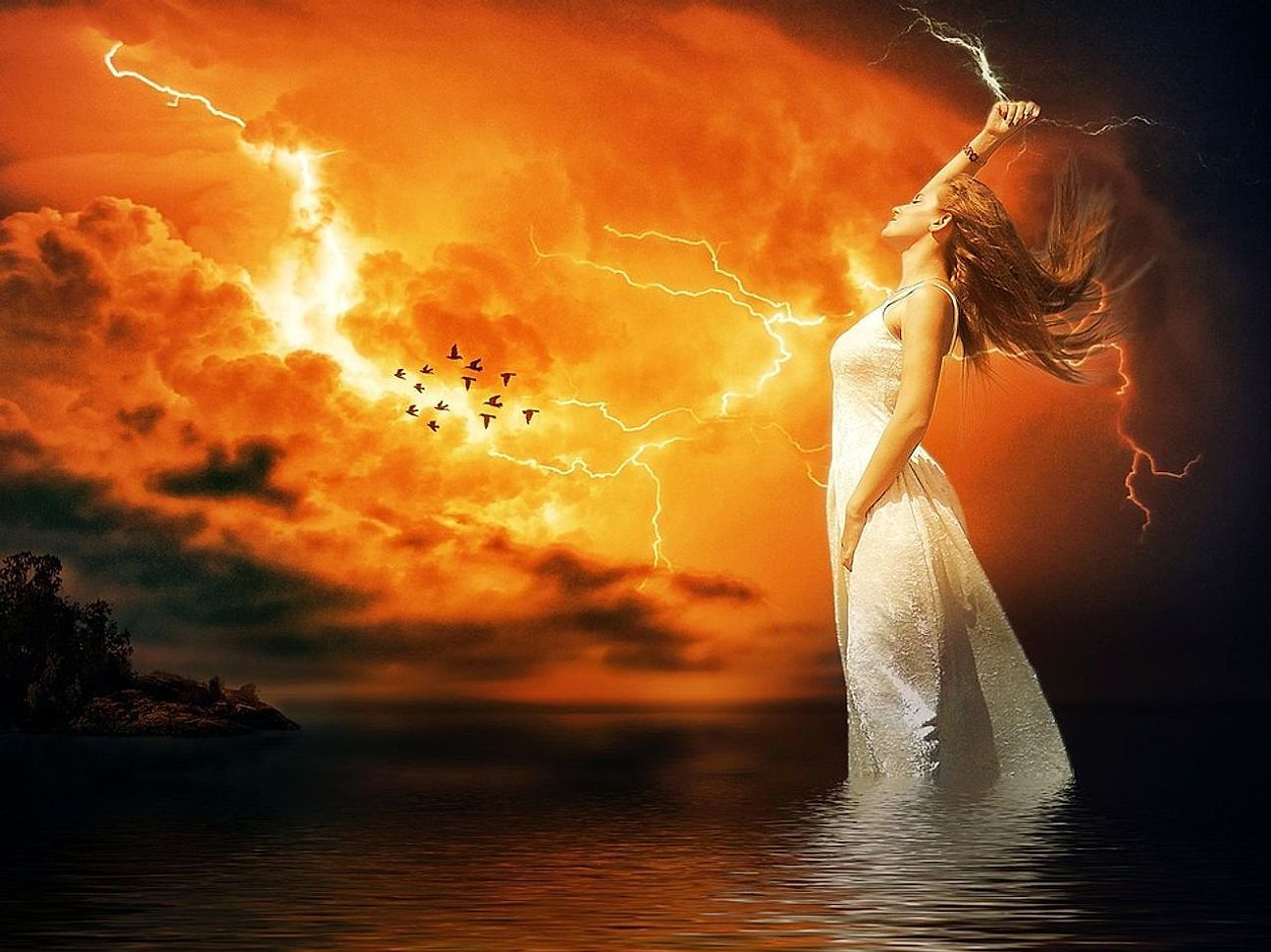 Storm clouds illuminated by a bright electrical discharge at night